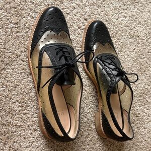 Stuart Weitzman Black and Gold Lace-Up Wingtip Boots